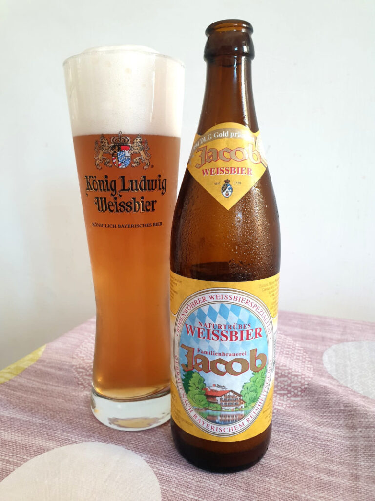 Bottle of Jacob Weissbier beside a full glass